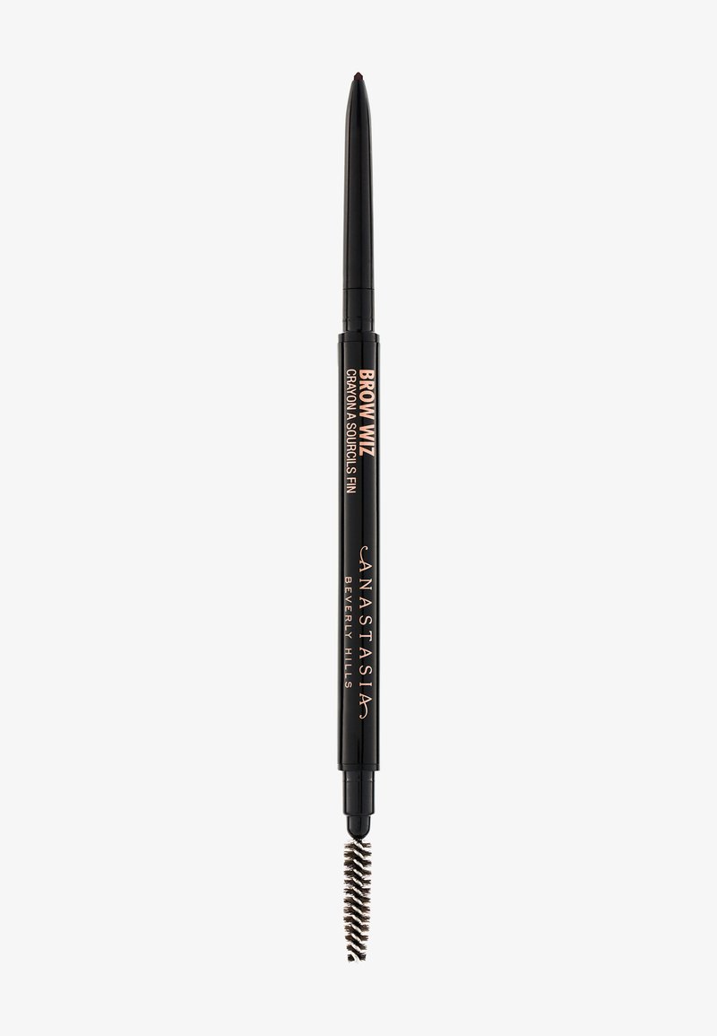 Brow Wiz pencil in black with a fine tip for precise application. Features a spoolie brush on one end for blending. Sleek design with branding.
