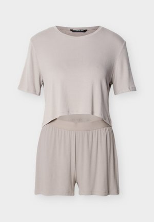 Light beige ribbed short-sleeve crop top paired with matching loose shorts featuring an elastic waistband.