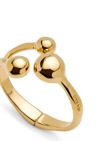 Bague ajustable en ton or avec un design lisse et arrondi, ornée de deux accents sphériques. L'anneau est élégant et poli.