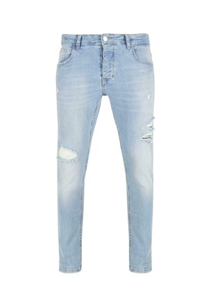 Light blue denim jeans with a slim fit, featuring multiple distressed areas and frayed edges. Standard five-pocket design.