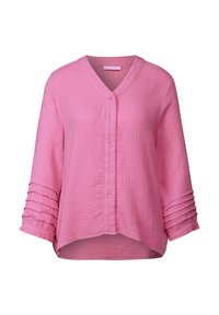 Blouse rose, texturée, avec un col en V, fermeture à boutons, et des manches trois-quarts à poignets plissés. Tissu léger avec une coupe décontractée.