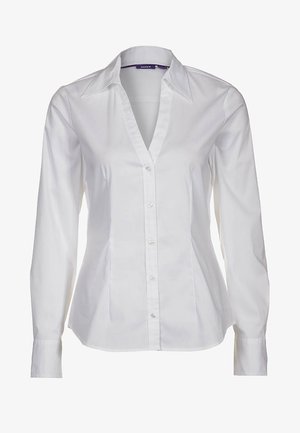 White long-sleeve shirt made of cotton, featuring a pointed collar, button front, and a tailored fit with smooth texture.