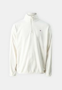 Pullover di pile bianco con collo a mezza cerniera, maniche lunghe e un piccolo logo sul lato sinistro del petto. Tessuto morbido e vestibilità rilassata.