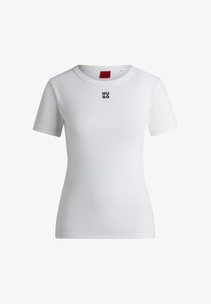 Hvit bomull t-skjorte med rund halslinning og korte ermer. Har en liten svart "HUGO"-logo på brystet. Glatt tekstur.