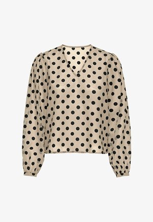 Kreminė palaidinė su juodais taškais, V formos iškirpte ir ilgomis pūkuotomis rankovėmis, turinti lygų, blizgantį paviršių.