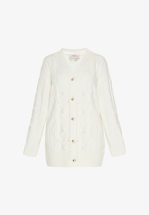 Baltā adītā džempera jaka ar V-veida kaklu, pogu aizdari un teksturētu dimanta rakstu, kas rotāta ar pom-pom akcentiem un ribotām piedurknēm.