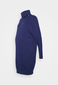 Abito premaman in maglione blu navy con colletto alto, dettagli con zip e accenti a coste lungo le spalle e i lati. Tessuto a maglia morbida.