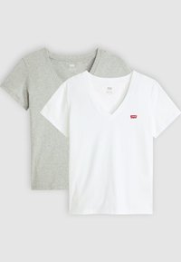 Two V-neck t-shirts: one grey and one white. Both have short sleeves, a soft cotton texture, and a small red brand logo on the white shirt.