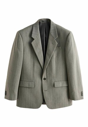 Hands adjusting the cuff of a gray pinstripe suit jacket over a white shirt and patterned tie.