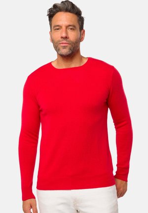 Pull-over rouge à manches longues en mailles lisses, avec un col rond et des poignets et un ourlet côtelés. Design simple et uni.