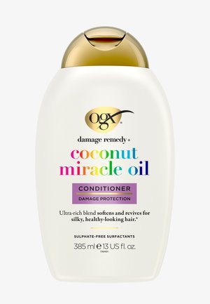 Botella de acondicionador OGX Coconut Miracle Oil con tapa dorada, protección contra daños, sin sulfatos, 385 ml, suaviza y revitaliza el cabello para un aspecto sedoso y saludable.