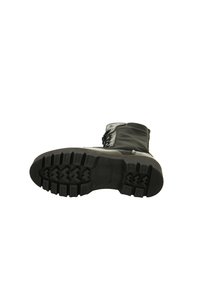 Black boot with rugged rubber outsole, lace closure, and water-resistant upper. Features a padded collar and textured pattern on sole.