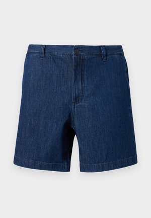 Short en denim bleu foncé avec passants de ceinture, bouton avant et fermeture éclair, présenté sur un fond clair uni.