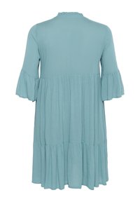 Light blue, knee-length dress with a ruffled neckline and flared sleeves. Features tiered fabric for added texture and flow.