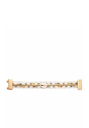 Bracelet featuring white beads, gold chain accents, and a central seashell detail. The clasp is gold-toned with engraved brand name.