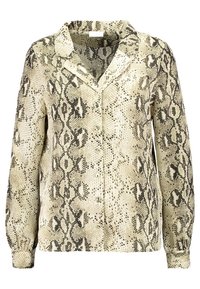 Bluzka z długim rękawem w beżowo-czarny wzór węża. Posiada kołnierzyk, zapięcie na guziki i elastyczne mankiety. Gładka tekstura.