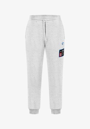 Pantaloni della tuta grigi realizzati in tessuto morbido, con una vita elastica, coulisse e una toppa laterale con testo e grafiche colorate.