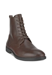 Bottes basses en cuir brun avec un bout arrondi, dotées d'un design à lacets et d'une semelle en caoutchouc basse. Texture lisse avec des détails de couture subtils.