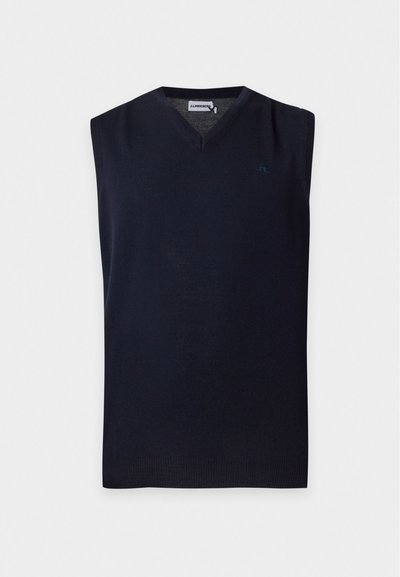 Gilet en tricot sans manches bleu marine avec col en V et logo subtil sur la poitrine, présenté sur un fond blanc uni.