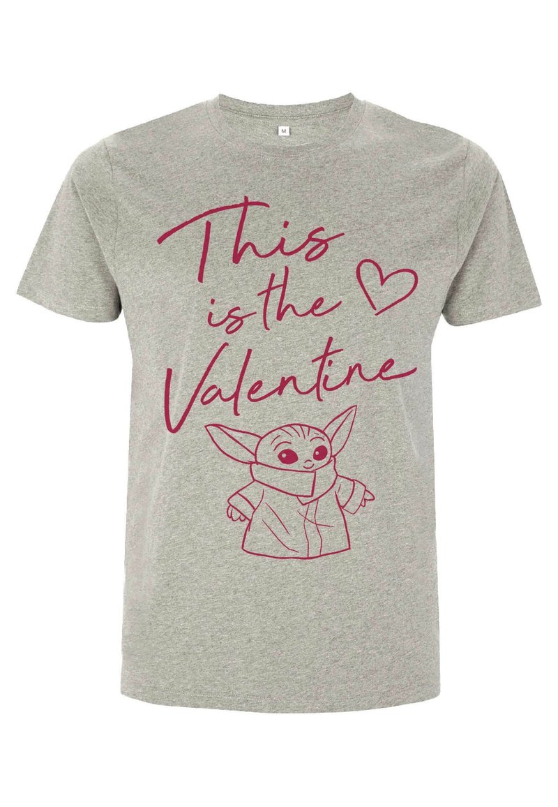 Šedé bavlněné tričko s růžovou grafikou postavy s velkýma ušima, text zní "Tohle je ❤️ Valentýn" v hravém písmu.