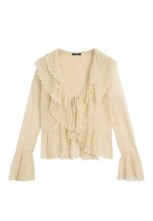 Kremowa bluzka z długim rękawem z koronką, z marszczonym głębokim dekoltem w kształcie litery V, wiązaniem z przodu oraz rozszerzanymi mankietami z delikatnym, teksturowanym wzorem.