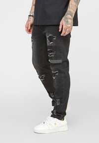 SIKSILK PATCH WORK DISTRESSED - Calças de ganga justas - washed black