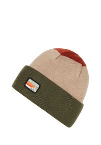 Knitted beanie with a folded olive green cuff, beige body, and a rust-red top. Features a small rectangular logo patch.