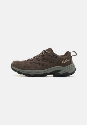 Brown hiking shoe made from suede and mesh, featuring a thick rubber sole, textured accents, and laces for secure fit.