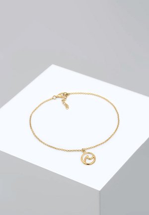 Gold chain bracelet with a fine link design, featuring a circular charm with a wave motif. Clasp closure and adjustable length.