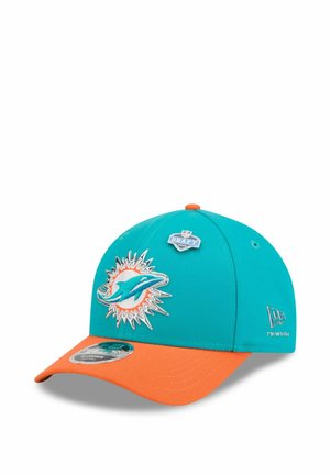 Teal and orange Miami Dolphins cap with logo, NFL Draft 2023 pin on front, and New Era brand logo on side.