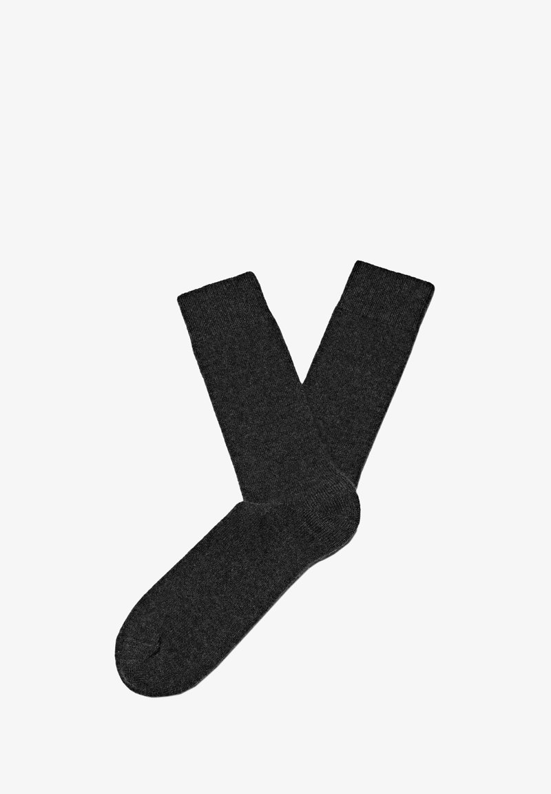 Calzini in cotone grigio scuro con una texture a coste e forma classica, dotati di tallone e punta rinforzati per una maggiore durata.