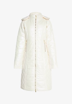 Valge pätsi kätmine jakk kõrge kraega, tõmblukuga esiküljel ja kuldsete detailide aktsentidega. Omab eemaldatavat kapuutsi ja pikki varrukaid.