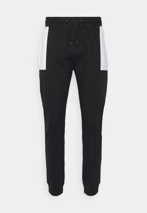 MONO BLOCK JOGGER UNISEX - Tracksuit bottoms - black