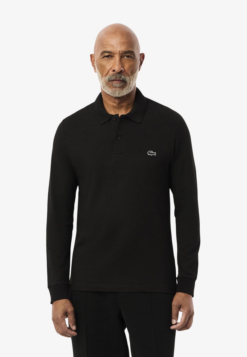 Schwarzes Langarm-Polo-Shirt aus Baumwolle, mit einer Drei-Knopf-Leiste und kleinem gesticktem Logo auf der linken Brust.