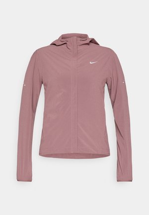 Leichte rosa Nike-Jacke mit Kapuze, langen Ärmeln und Reißverschluss. Verfügt über ein kleines Logo auf der Brust und Seitentaschen.