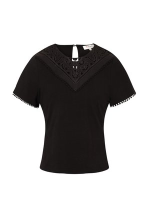 Schwarzes Kurzarmoberteil mit einem Spitzenbesatz am Ausschnitt, der ein dekoratives Muster und Pomponbesatz an den Ärmeln aufweist. Mit einem Reißverschlussdetail auf der Rückseite.
