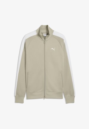 Beige Puma lynlåsjakke med hvide skulderstriber, ribbet krave og ærmegab, lynlåslommer i siden og Puma-logo på brystet.