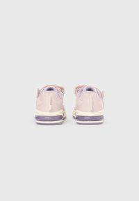 Pair of pink children's sneakers with velcro straps, purple cushioned soles, and padded ankle collars viewed from the back on a white background.
