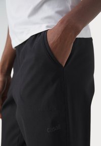 Casall COMFORT PANTS - Treniņtērpa apakšdaļas - black