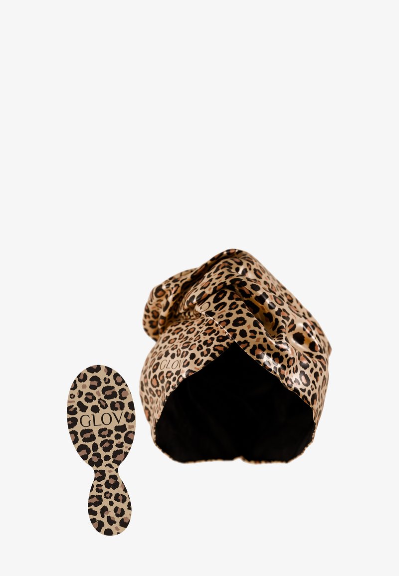 Fascia per capelli con stampa leopardata in tessuto lucido, abbinata a una spazzola ovale coordinata. Entrambi presentano un design a macchie marroni e nere.
