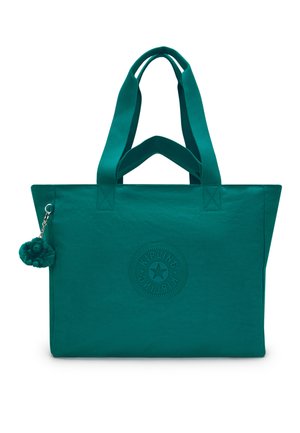 Teal Kipling skuldertaske med to sæt håndtag og en lille blød nøglering fastgjort på siden.