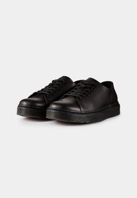 Chaussures noires en cuir avec bout rond, design à lacets, semelle en caoutchouc texturée et détails minimalistes. Surface lisse avec un léger éclat.
