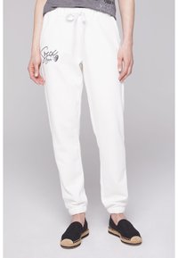 Soccx MIT GLITTER PRINT - Pantalones deportivos - ivory