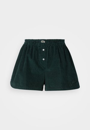 Dark green corduroy shorts with an elastic waistband, three buttons at the front, and embroidered logo detail on the side.