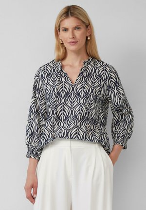 Marineblauwe en crèmekleurige blouse met een bladerenpatroon, V-hals en gathers aan de mouwen. Lichte stof met een ontspannen pasvorm.
