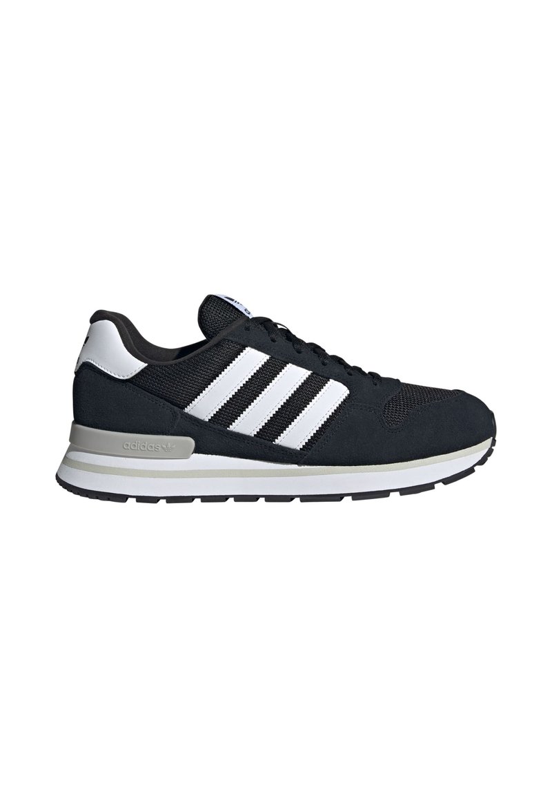 Black and white Adidas sneaker with three white stripes on the side, cushioned midsole, and rubber outsole, shown in profile facing right.