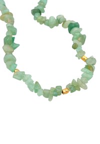 Green gemstone necklace featuring irregularly shaped beads, alternating with small gold accents for contrast and texture.