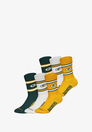 Zestaw skarpetek Packers w zielono-białych i złotych bawełnianych mieszankach, z prążkowanymi mankietami, logo drużyny oraz napisem "PACKERS" na żółtych parach.