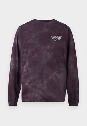 Fioletowa koszulka tie-dye z długim rękawem z małym białym logo "Carhartt WIP" na lewej piersi.