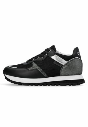 Black athletic shoes with mesh and leather materials. Features silver accents, a textured silver rear panel, and black rubber soles with grip.